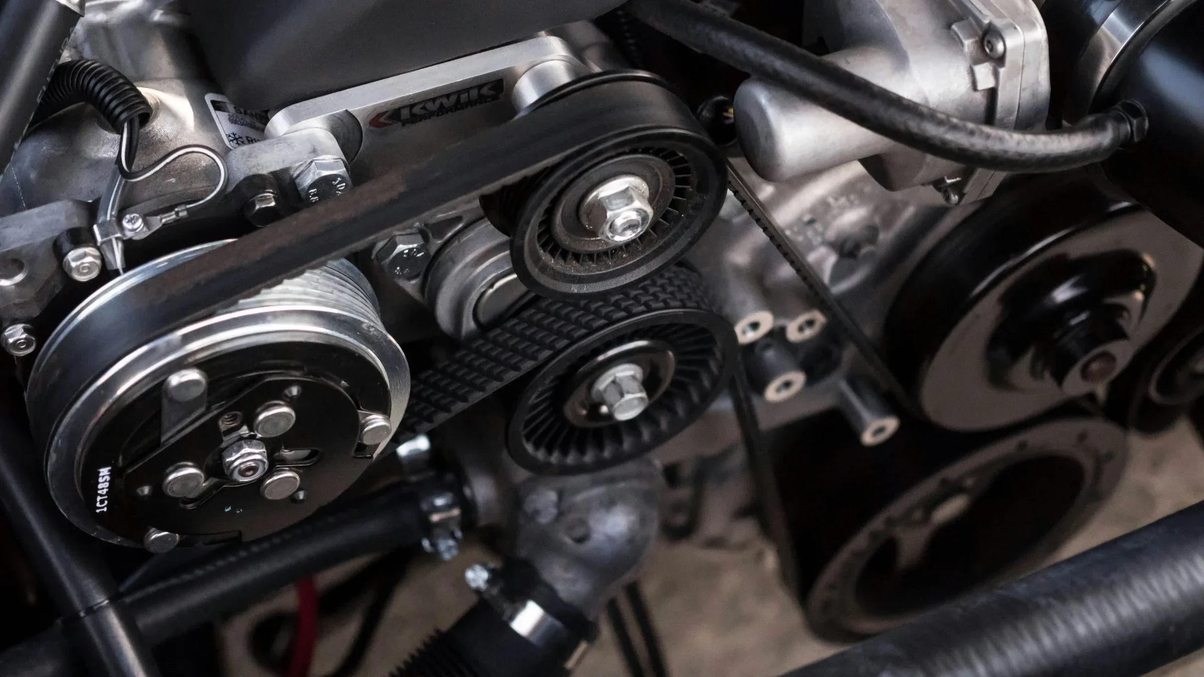 Belts and pulleys on an engine accessory drive